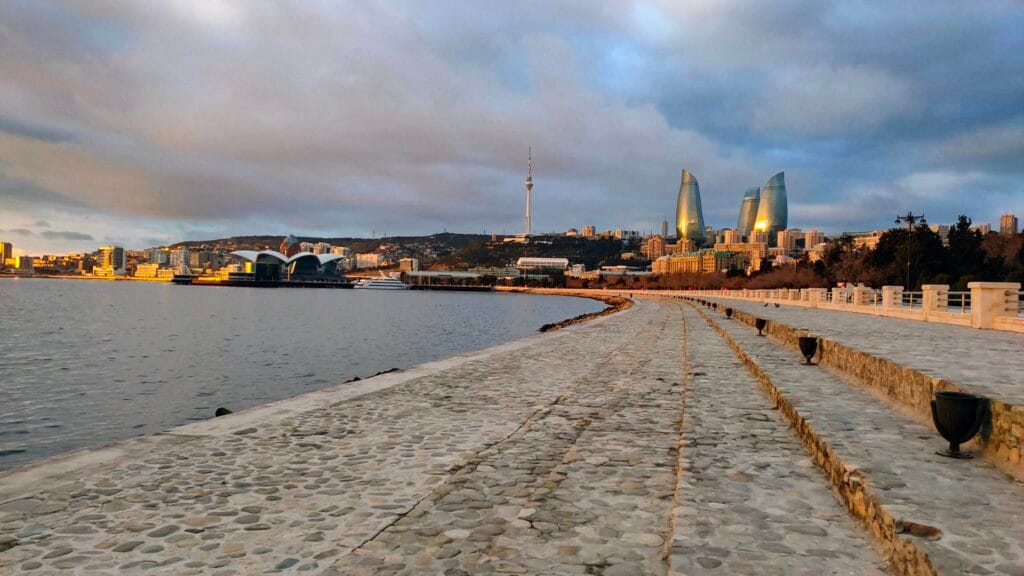 What is solo traveling? Baku city view from Caspian Sea and flame tower in the background